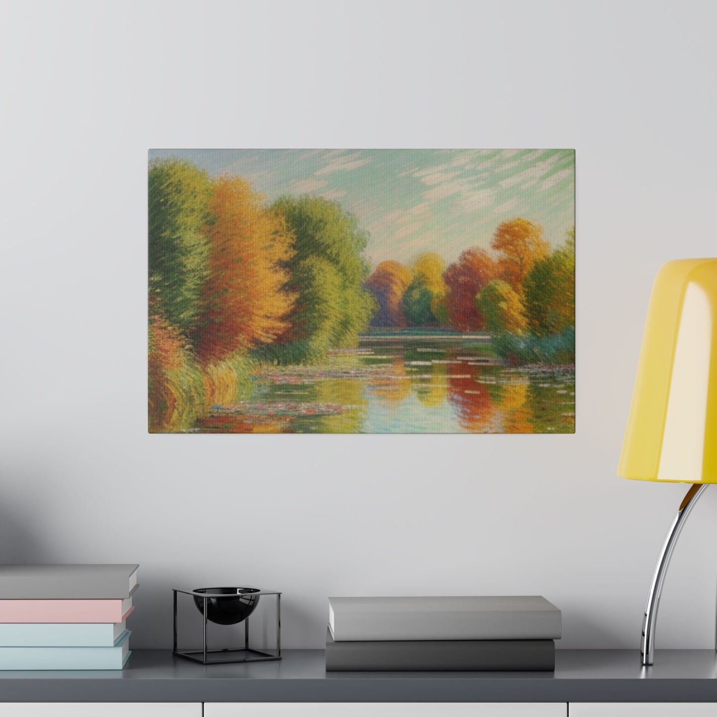 A serene lake reflects a vibrant display of autumn trees with hues of orange, yellow, and red. The soft, pastel sky above complements the tranquil scene, enhancing the overall sense of peace.