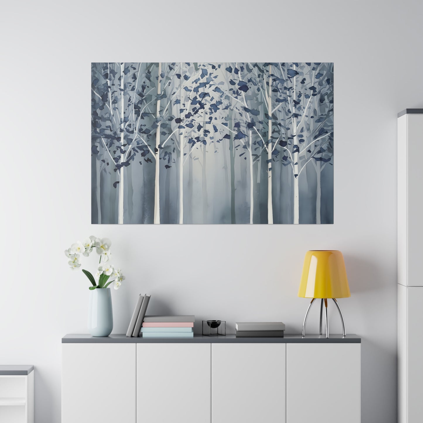 A serene grove of slender trees stands shrouded in mist, their leaves a cool tapestry of blues against the muted backdrop. The scene evokes a tranquil and somewhat mystical forest atmosphere, with the trees fading into the white foggy distance.