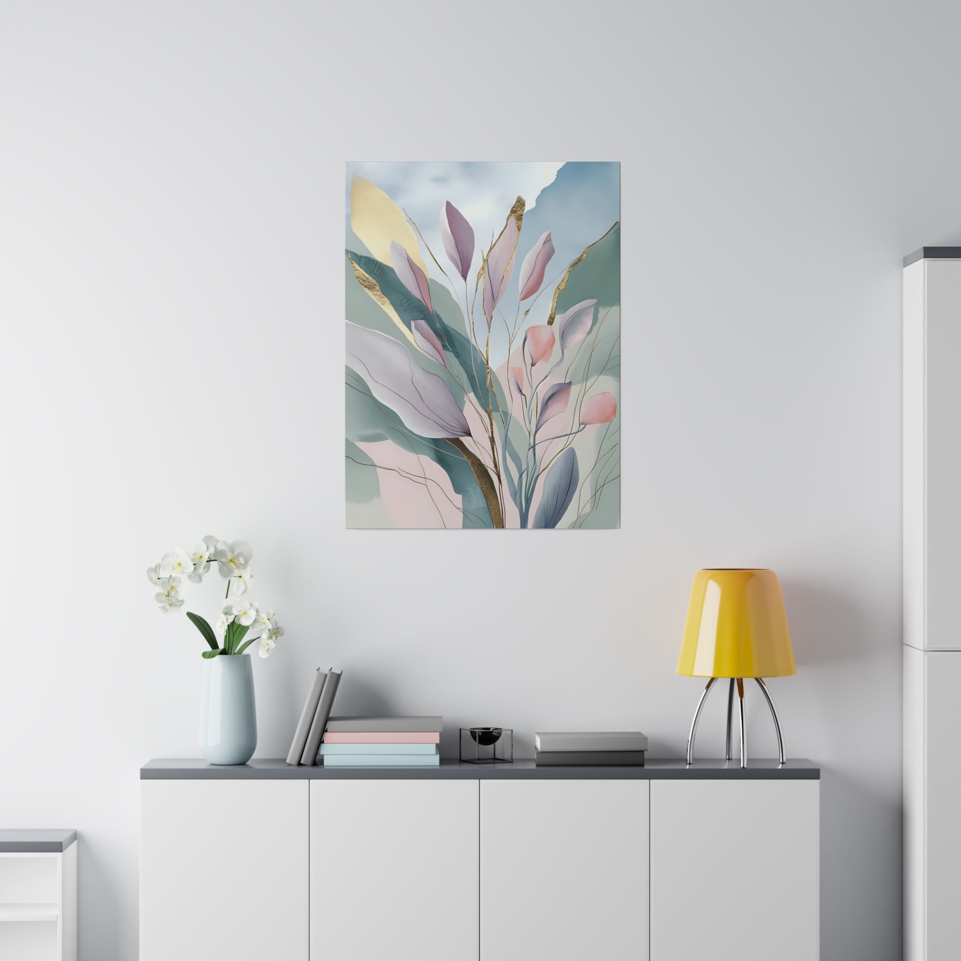 Delicate abstract watercolor leaves are depicted in soft pastel colors with accents of gold, creating a serene and ethereal composition. The background features subtle gradients of blue, green, and beige hues, adding depth and harmony to the scene.