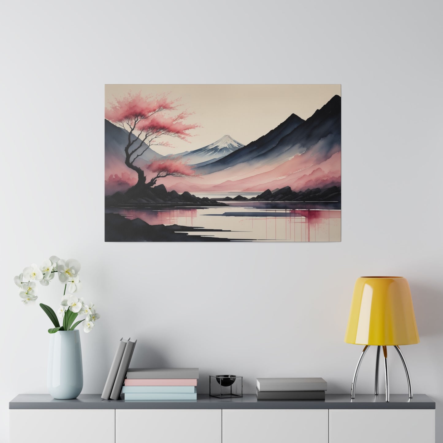 A serene abstract landscape features a snow-capped mountain in the background with hues of pink and purple adorning the sky. In the foreground, a tree with pink leaves stands beside still waters reflecting the tranquil scene.