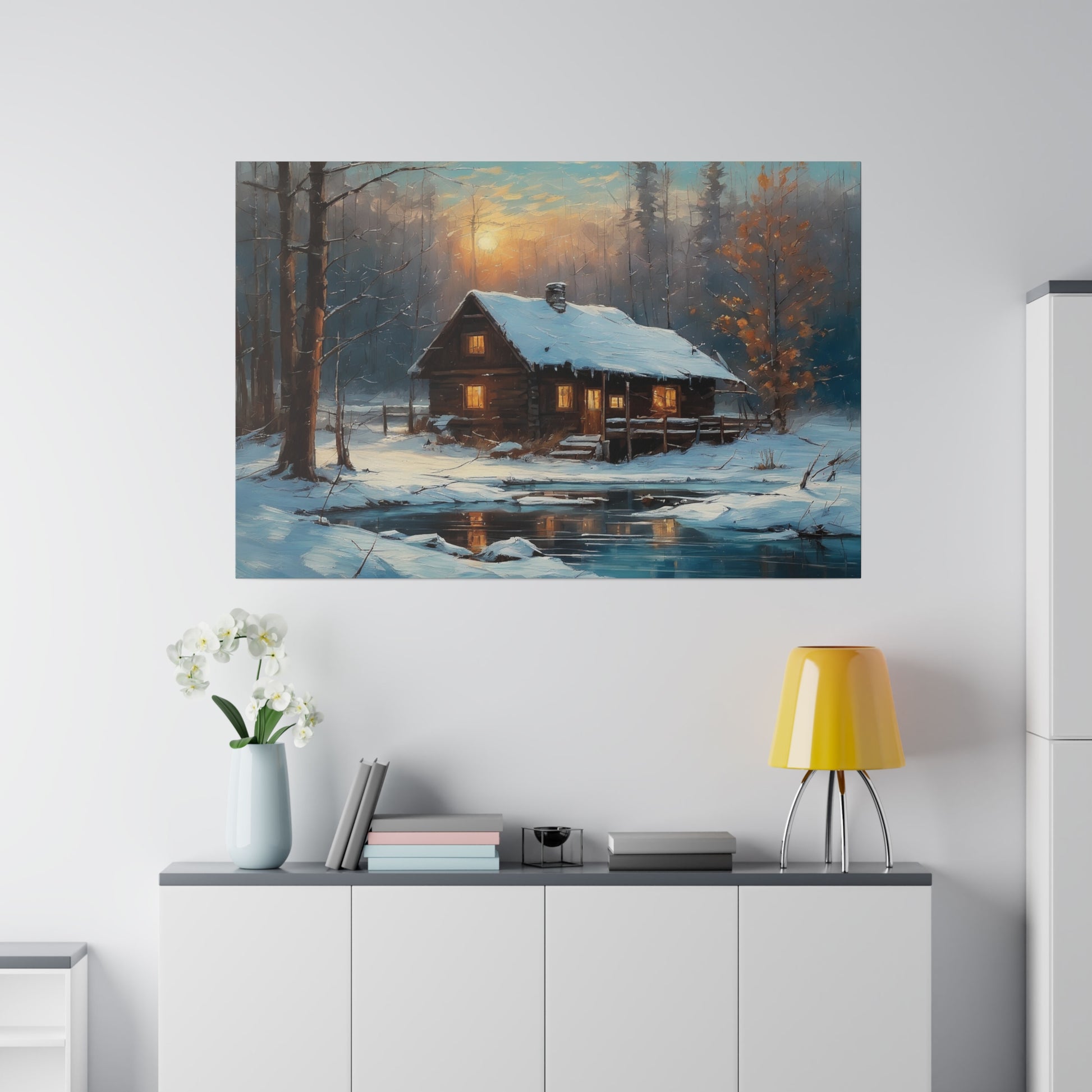 Invite the warmth and tranquility of a winter wonderland into your home with this Cozy Old Cabin in the Woods Wall Art Print. This enchanting artwork captures the serene beauty of a snow-covered landscape, where a warmly lit cabin nestles among trees beside a tranquil pond, evoking a sense of peace