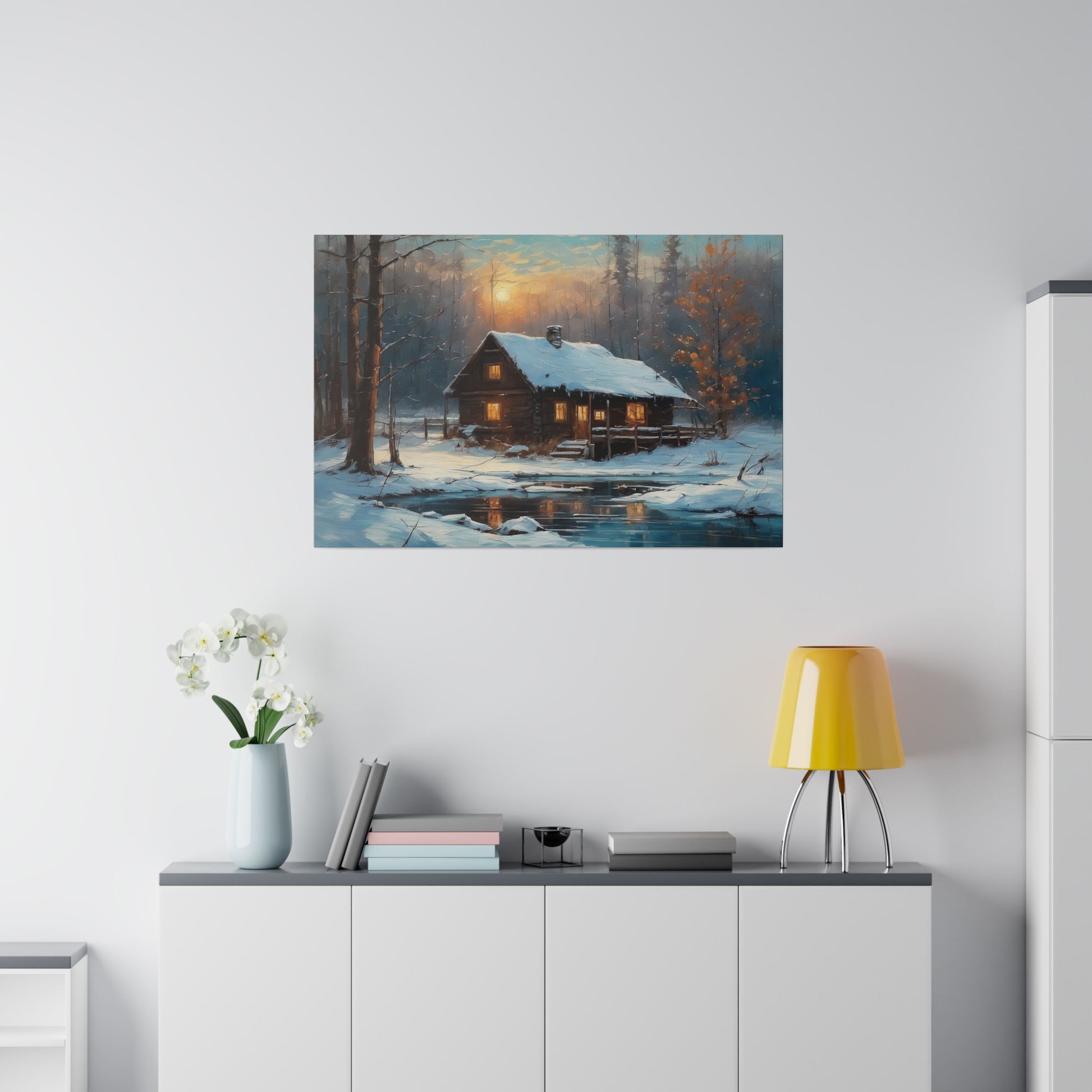 Invite the warmth and tranquility of a winter wonderland into your home with this Cozy Old Cabin in the Woods Wall Art Print. This enchanting artwork captures the serene beauty of a snow-covered landscape, where a warmly lit cabin nestles among trees beside a tranquil pond, evoking a sense of peace