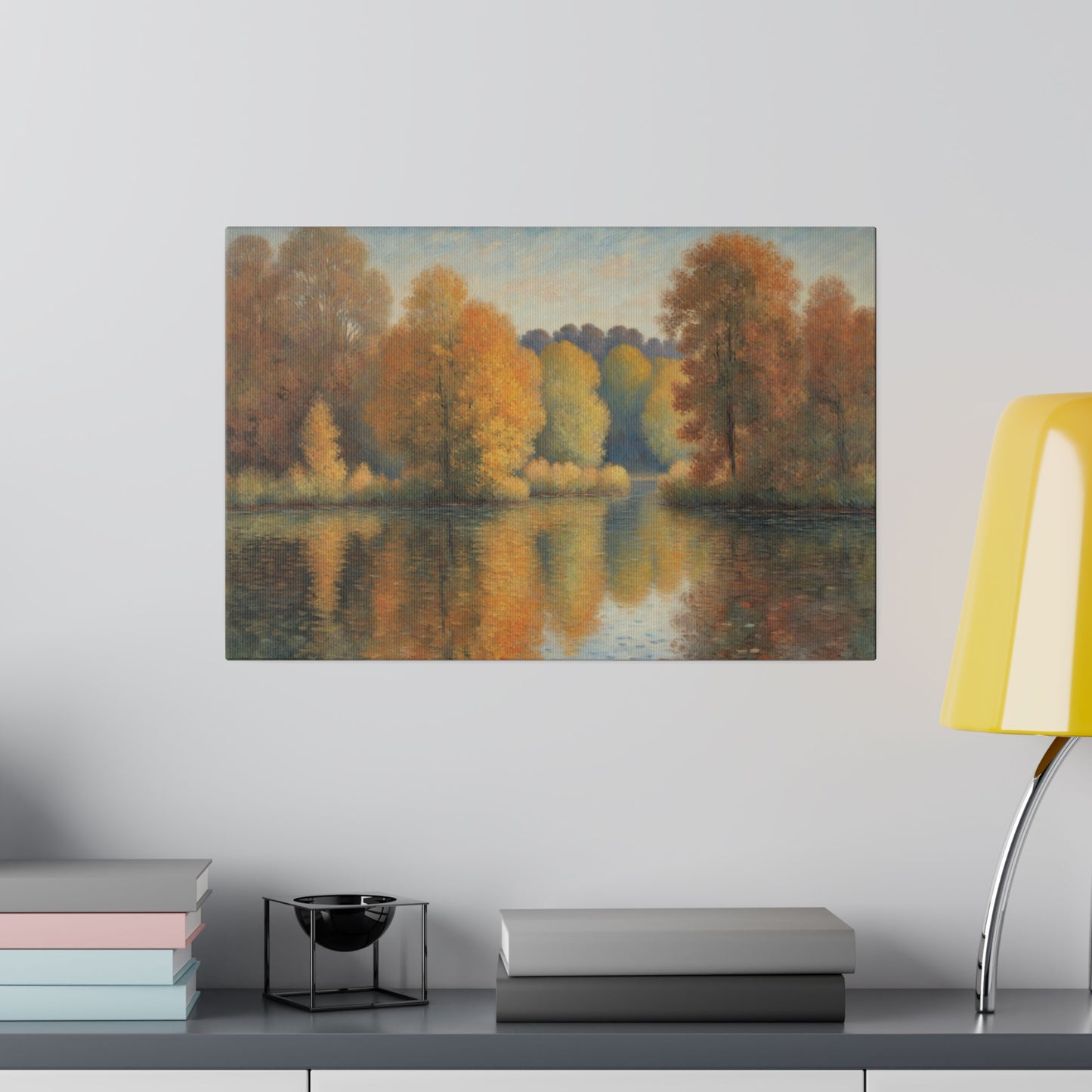 A serene lake reflects a vibrant display of autumn trees with hues of orange, yellow, and red. The soft, pastel sky above complements the tranquil scene, enhancing the overall sense of peace.